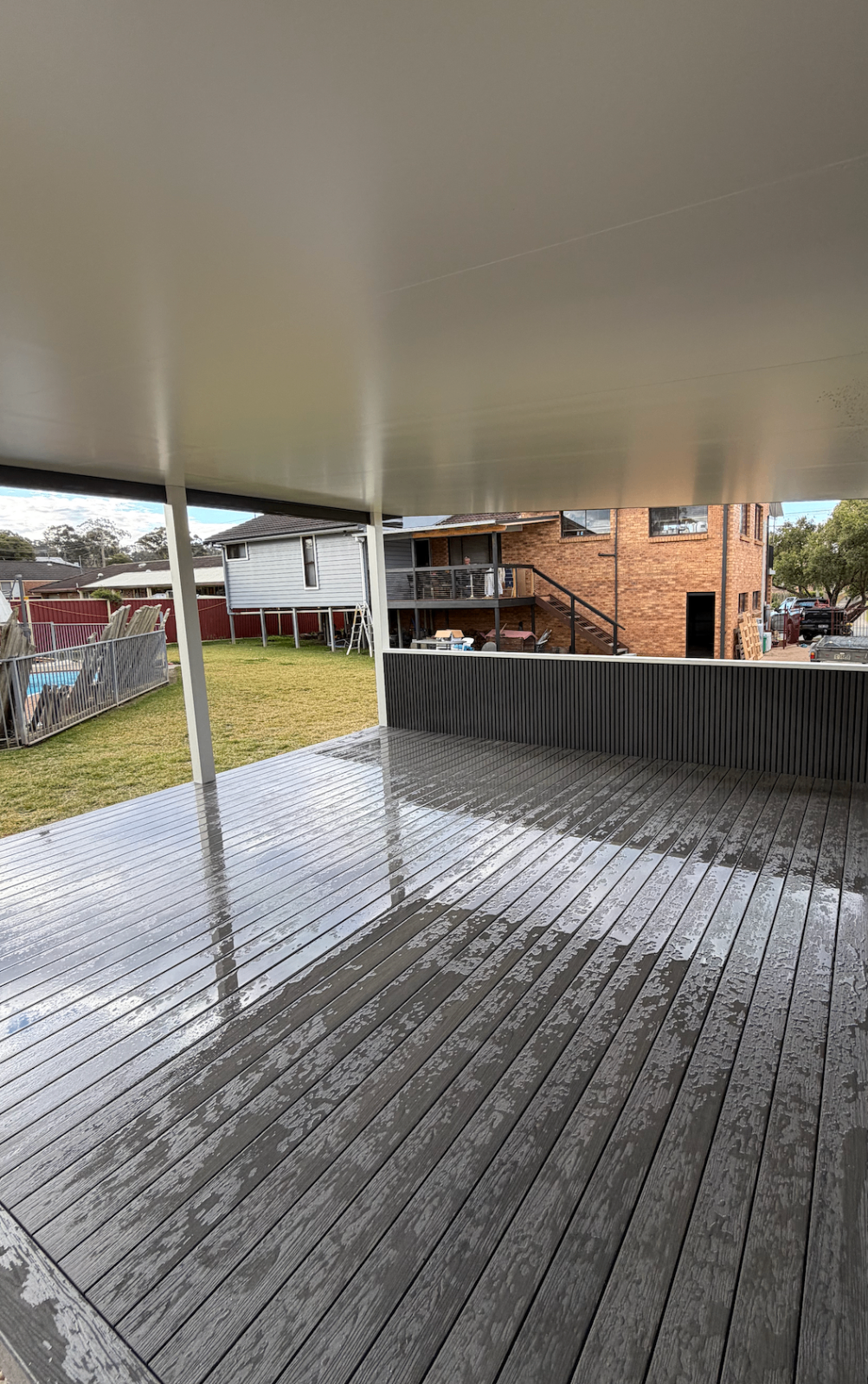 Composite deck and patio build by Superior Carpentry & Maintenance